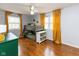 bedroom with a bunk bed, wood floors, and bright windows at 7811 Hoover Rd, Indianapolis, IN 46260