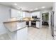 Spacious kitchen with white cabinetry, granite countertops, and stainless steel appliances at 7811 Hoover Rd, Indianapolis, IN 46260