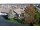 Aerial view of a residential home featuring a well-manicured lawn and mature trees at 7971 Cool Hollow Pl, Indianapolis, IN 46237