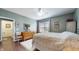 This bedroom includes an antique-style wooden dresser, hardwood floors, and a decorative butterfly tapestry at 7971 Cool Hollow Pl, Indianapolis, IN 46237