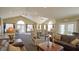 Community room showcases cozy seating, lamps, tables, and natural light creating a warm and inviting gathering space at 7971 Cool Hollow Pl, Indianapolis, IN 46237
