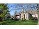 Well-maintained single-Gathering home with stone facade, manicured lawn, and mature trees at 7971 Cool Hollow Pl, Indianapolis, IN 46237