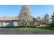 Charming one-story home with red shutters, complemented by a flowering tree and well-maintained landscaping at 7971 Cool Hollow Pl, Indianapolis, IN 46237