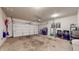 Spacious two-car garage with ample storage and work space for projects and parking at 7971 Cool Hollow Pl, Indianapolis, IN 46237