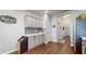 A brightly lit kitchen features custom cabinets, hardwood floors, and a charming bakery sign at 7971 Cool Hollow Pl, Indianapolis, IN 46237