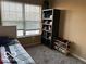 Functional bedroom featuring a large window, neutral walls, and ample storage space for organization and comfort at 804 Seabreeze Dr, Avon, IN 46123