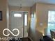View of front door with side window into the foyer at 804 Seabreeze Dr, Avon, IN 46123