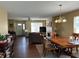 Spacious living and dining area with hardwood floors and a fireplace at 804 Seabreeze Dr, Avon, IN 46123