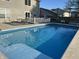 Sparkling in-ground pool with steps and large concrete deck, ready for summer relaxation and recreation at 804 Seabreeze Dr, Avon, IN 46123