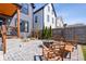 Cozy backyard with a fire pit, outdoor seating, and a well-maintained brick patio at 807 E Minnesota St, Indianapolis, IN 46203