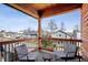 Charming balcony featuring chairs and a table, offering a cozy spot to relax and enjoy the neighborhood views at 807 E Minnesota St, Indianapolis, IN 46203