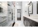 Modern bathroom featuring a glass-enclosed shower, sleek vanity, and stylish fixtures with neutral color palettes at 807 E Minnesota St, Indianapolis, IN 46203