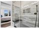 Elegant bathroom showcasing a glass-enclosed shower with stylish tiling and a convenient shower bench at 807 E Minnesota St, Indianapolis, IN 46203