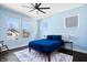 Inviting bedroom with a large window that offers a bright, airy atmosphere, accentuated by hardwood floors at 807 E Minnesota St, Indianapolis, IN 46203
