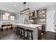 Bright kitchen with a large island and stainless-steel appliances flows into living area at 807 E Minnesota St, Indianapolis, IN 46203