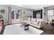 Comfortable living room offers great natural light, chic decor, and hardwood flooring at 807 E Minnesota St, Indianapolis, IN 46203