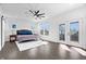Spacious main bedroom with large windows, stylish ceiling fan, and a walk out balcony at 807 E Minnesota St, Indianapolis, IN 46203