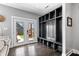 Stylish mudroom with integrated storage, bench seating and access to the outdoor patio through double doors at 807 E Minnesota St, Indianapolis, IN 46203