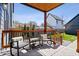 Outdoor porch with chairs and a small table offering a relaxed seating area at 807 E Minnesota St, Indianapolis, IN 46203