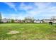 Spacious backyard featuring a swing set and ample grassy area for outdoor activities at 8531 Aberdeenshire Ct, Indianapolis, IN 46259