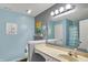 Bathroom with vanity and decorative mirror provides practical elegance at 8531 Aberdeenshire Ct, Indianapolis, IN 46259