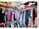 Full walk-in closet with double racks and organized shelves at 8531 Aberdeenshire Ct, Indianapolis, IN 46259