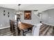 Elegant dining space with hardwood floors, neutral wall color, and access to the stairway at 8531 Aberdeenshire Ct, Indianapolis, IN 46259