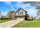 Attractive two-story home with a two-car garage, brick accents, and a well-maintained lawn and landscaping at 8531 Aberdeenshire Ct, Indianapolis, IN 46259