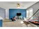 Comfortable game room with television, shelving for games, window with natural light and fun recreational space at 8531 Aberdeenshire Ct, Indianapolis, IN 46259