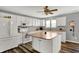 A lovely kitchen features white cabinets, stainless steel appliances, and an island at 8531 Aberdeenshire Ct, Indianapolis, IN 46259