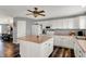 This kitchen features white cabinets, stainless steel appliances, and a center island at 8531 Aberdeenshire Ct, Indianapolis, IN 46259