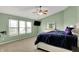 Bright and airy main bedroom with large windows, neutral carpet, soft natural light and television at 8531 Aberdeenshire Ct, Indianapolis, IN 46259