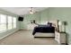 Comfortable main bedroom with a large bed, dresser, large windows, and neutral carpet at 8531 Aberdeenshire Ct, Indianapolis, IN 46259