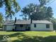 Spacious backyard featuring green grass and mature trees, offering a serene outdoor retreat at , Indianapolis, IN 46226