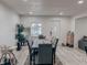 Cozy dining room features a long wooden table, gray chairs, and decor at , Indianapolis, IN 46226