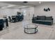 Open-concept living and dining area with light wood floors, large windows, and modern decor create a welcoming space at , Indianapolis, IN 46226