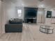 Spacious living room features a brick fireplace, mounted TV, and connects to an open kitchen for seamless living at , Indianapolis, IN 46226