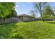 Well-maintained backyard offers ample green space, perfect for outdoor activities and relaxation at 8560 N College Ave, Indianapolis, IN 46240
