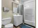 Modest bathroom features white vanity and a shower/tub combo with curtain at 8560 N College Ave, Indianapolis, IN 46240