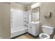 A full bathroom featuring a shower-tub combination and a single sink vanity at 8560 N College Ave, Indianapolis, IN 46240