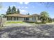 Charming single-story home with a well-maintained exterior and ample parking space at 8560 N College Ave, Indianapolis, IN 46240