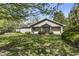 Well-kept home with a neatly landscaped front yard, offering a warm and inviting ambiance at 8560 N College Ave, Indianapolis, IN 46240
