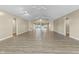 Large and spacious open living area with light wood floors and neutral paint at 8560 N College Ave, Indianapolis, IN 46240