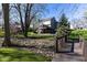Beautiful backyard view with mature trees, creek, and a bridge to backyard at 9789 Logan Ln, Fishers, IN 46037