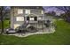 Beautiful backyard featuring a spacious deck, a screened in porch, and a well maintained lawn at 9789 Logan Ln, Fishers, IN 46037