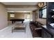 Basement rec room with pool table, lounge area, and natural light from a window at 9789 Logan Ln, Fishers, IN 46037
