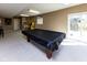 Basement rec room featuring a pool table, sliding glass door, and lots of space at 9789 Logan Ln, Fishers, IN 46037