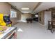 Finished basement recreation room with a pool table, games, and ample space for activities at 9789 Logan Ln, Fishers, IN 46037