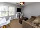 Comfortable bedroom or office space featuring a desk, modern shelving, and a sofa for relaxing at 9789 Logan Ln, Fishers, IN 46037