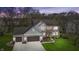 Attractive two-story home featuring brick and siding, a two-car garage, and well-maintained landscaping at 9789 Logan Ln, Fishers, IN 46037